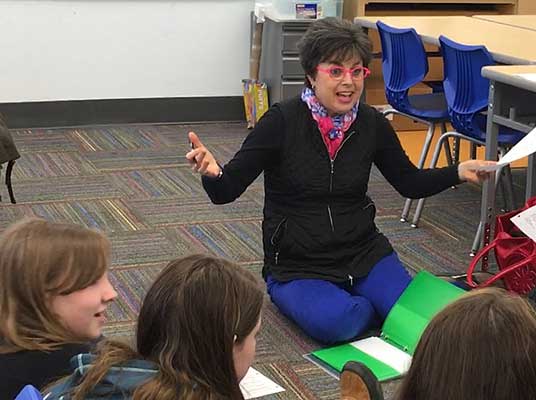 Pamela teaching children