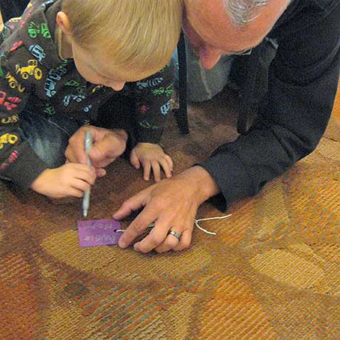 Dad with his son filling out Hope Card