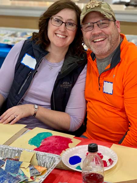 Veterans and families during workshops creating art for Yellow Ribbon installation